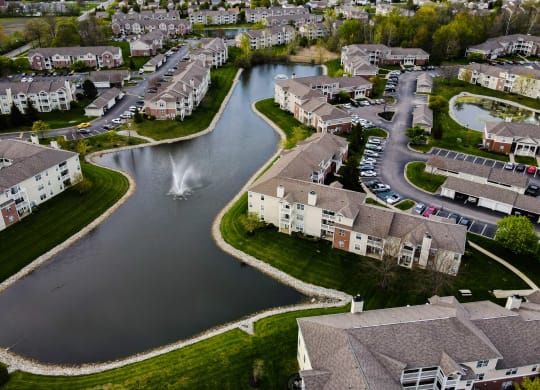 arial view of a subdivision with a lake and fountain at Latitudes Apartments, Indianapolis, IN