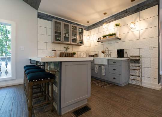 A kitchen with a bar area and a window at Laurel Woods Apartments, South Carolina, 29607