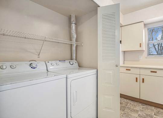 A laundry room with a washer and dryer.