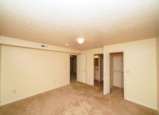 Bedroom with a walk-in closet and bathroom at Liberty Mills Apartments, Fort Wayne