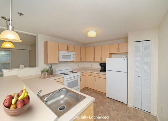 a kitchen with white appliances and a pantry at Limestone Creek Apartment Homes, Madison, AL