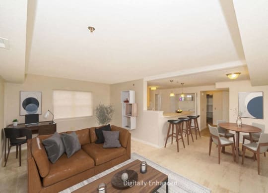 an end style living room and dining room with a couch and a table at Limestone Creek Apartment Homes, Madison, AL