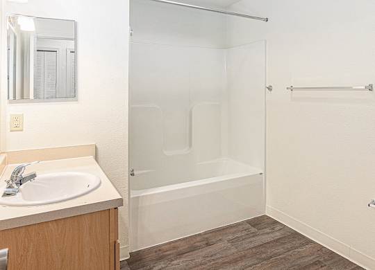 A bathroom with a sink and a bathtub/shower at Limestone Creek Apartment Homes, Madison, AL