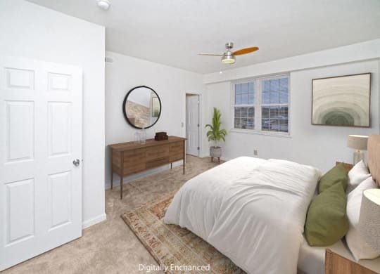 a bedroom with a large window and walk in closet at Limestone Creek Apartment Homes, Madison, AL