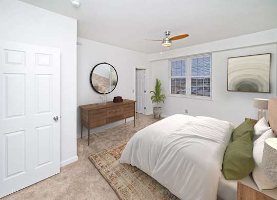 a bedroom with a large window and walk in closet at Limestone Creek Apartment Homes, Madison, AL