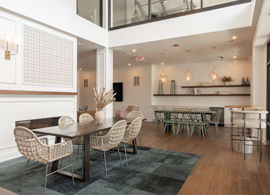 A dining room with a table and chairs at Luxe 360 on Centerpointe Apartments, Midlothian, VA