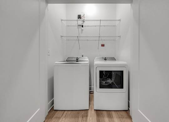 A white kitchen with a dishwasher and an oven at Luxe 360 on Centerpointe Apartments, Midlothian, VA, 23114