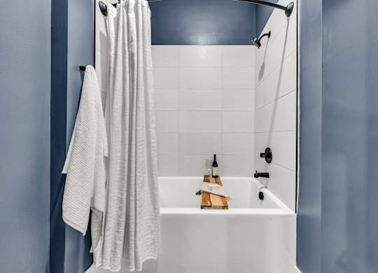 A white bathroom sink with a towel hanging on the wall at Luxe 360 on Centerpointe Apartments, Midlothian, 23114