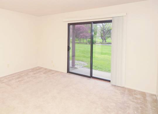 Spacious Living Room with a View at Madeira Apartments in Kalamazoo, MI