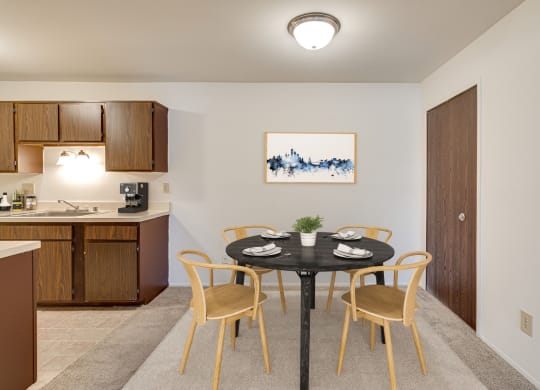 Magnolia Layout Dining Space Next to Kitchen at Fox Pointe Apartments, East Moline 61244