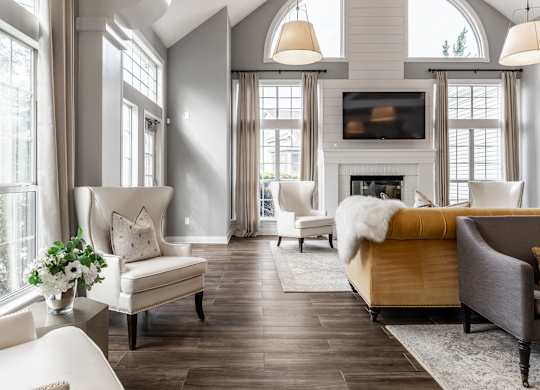 A living room with a fireplace and a couch at Mallard Bay Apartments, Crown Point, Indiana
