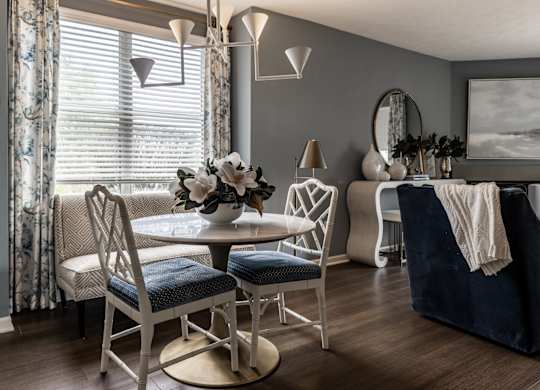A dining room with a table set for four at Mallard Bay Apartments, Crown Point, Indiana