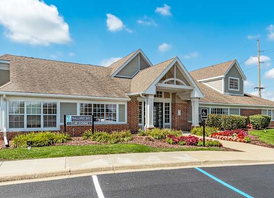 A building with a parking lot in front of it at Mallard Bay Apartments, Crown Point, Indiana