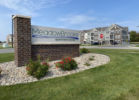 a sign in front of a building at Meadowbrooke Apartment Homes, Michigan, 49512