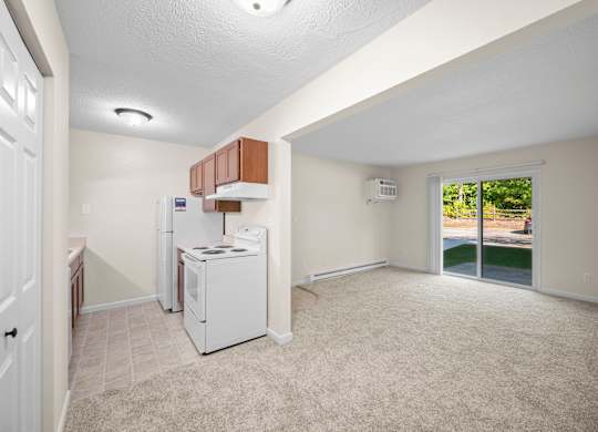 A kitchen area with a white fridge and a white dishwasherk at Timberlane Apartments, Peoria, Illinois