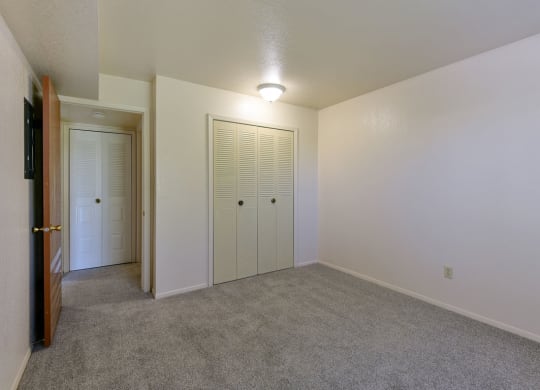 Bedroom with Large Closet at Old Monterey Apartments, Missouri, 65807 at Old Monterey Apartments, Missouri, 65807