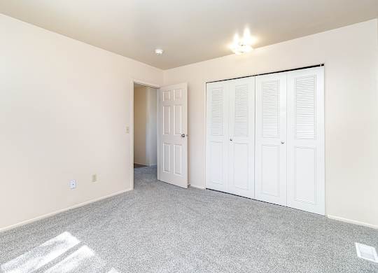 A bedroom with a large closet at Mount Royal Townhomes, Michigan