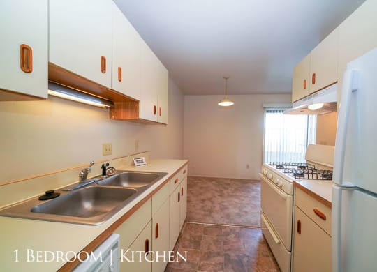 Kitchen With Almond Cabinetry at Mount Royal Townhomes, Michigan, 49009
