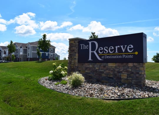 Entrance Sign for The Reserve at Destination Pointe in Grimies, IA