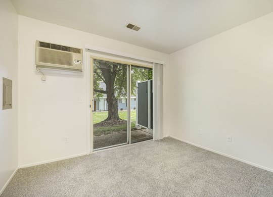 Slider to a semi private patio at Newport Village Apartments, Portage, MI