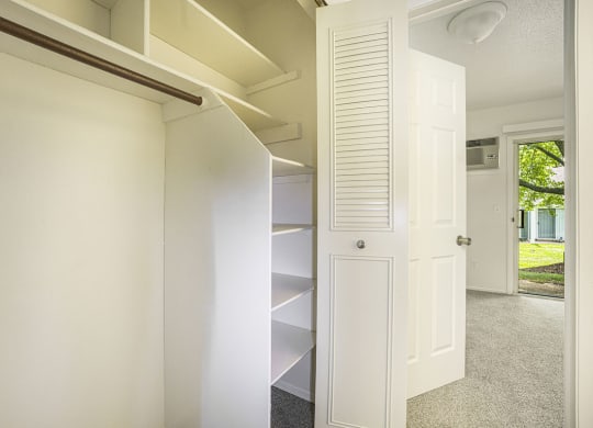 a large closet with shelves at Newport Village Apartments, Portage, MI