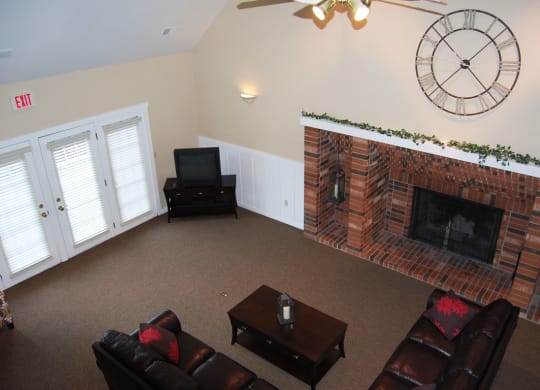 Clubhouse with High Ceiling and Fireplace at Newport Village Apartments, Portage, MI