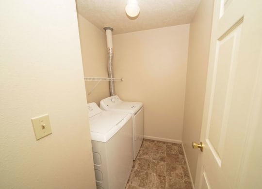 a laundry room with a washer and dryer in itat North Pointe Apartments in Elkhart, IN
