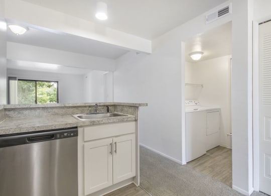 a kitchen view of a laundry room at North Pointe Apartments in Elkhart, IN
