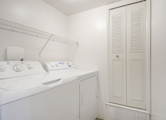 a laundry room with a washer and dryer at North Pointe Apartments in Elkhart, IN