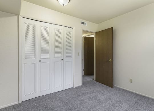 a bedroom with a large closet at Normandy Village Apartments, Indiana