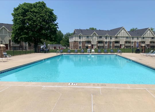 Refreshing Pool With Sundeck at Normandy Village Apartments in Michigan City, IN