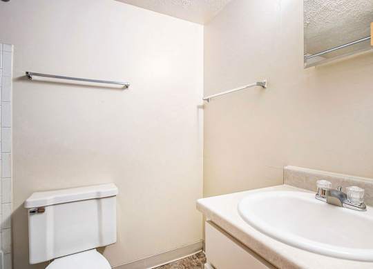 A bathroom with a bathtub and shower at Normandy Village Apartments, Michigan City