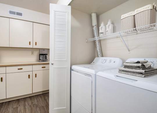 A laundry area with a washer and dryer at North Pointe Apartments in Elkhart, IN