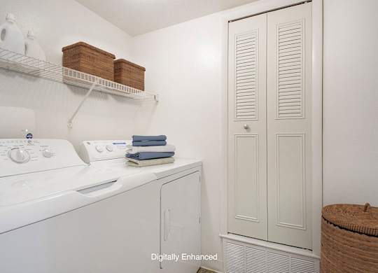 A full size washer and dryer in a laundry room at North Pointe Apartments, Elkhart