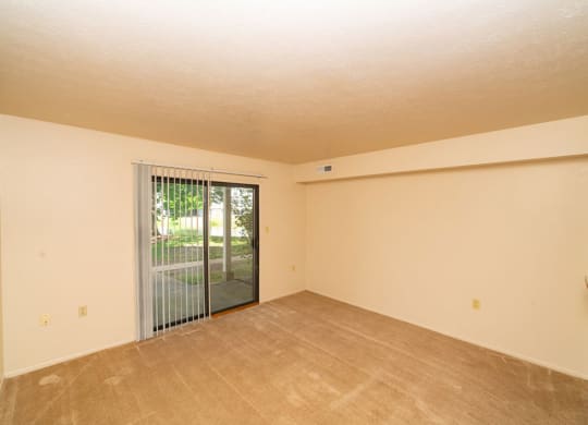 Living Room With Glass Door at North Pointe Apartments, Indiana, 46514