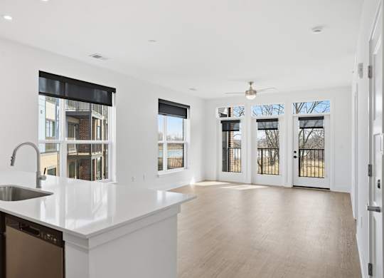 A kitchen with a sink and a window at Nuvo Flats, Indiana, 46410