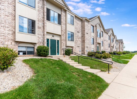 An exterior building with walking paths at Oak Shores Apartments, Wisconsin