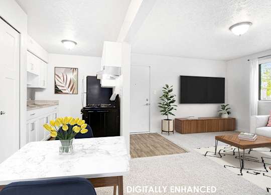 A modern kitchen, dining and living room with a large window at Old Farm Apartments, Elkhart, Indiana