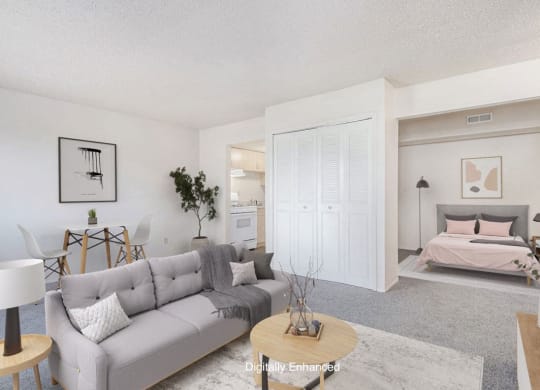 a living room with a couch and a bed at Old Farm Apartments, Elkhart, 46517