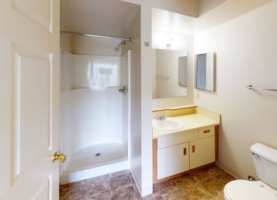 a second bathroom with a walk-in shower at Orchard Lakes Apartments in Toledo, Ohio