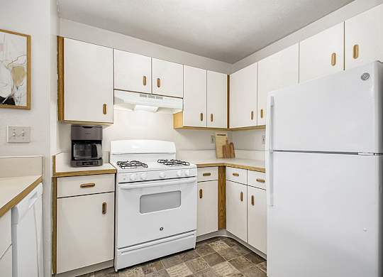 A kitchen with white appliances at Orchard Lakes Apartments, Toledo, 43615