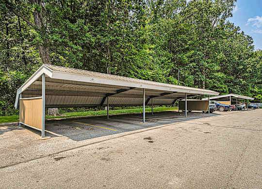 A parking lot with reserved carports at Orchard Lakes Apartments, Toledo, 43615