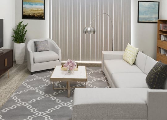 a living room with two couches and a coffee table  at Northport Apartments, Michigan, 48044