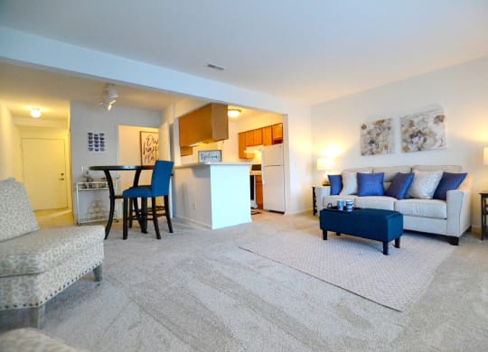 a living room with a couch and a chair at Northport Apartments, Michigan, 48044
