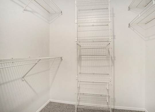 a walk-in closet with wardrobe organizers at Pine Knoll Apartments, Battle Creek, 49014