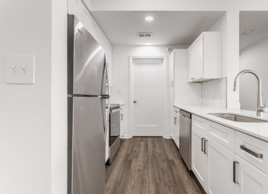 a renovated kitchen with white cabinets  at Polo Run Apartments, Greenwood, 46142