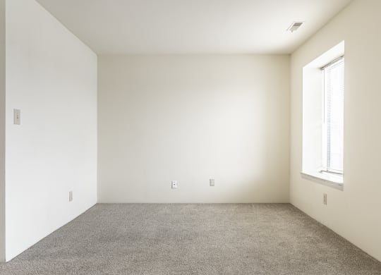 an empty room with a window and carpet at Scarborough Lake Apartments, Indianapolis, 46254