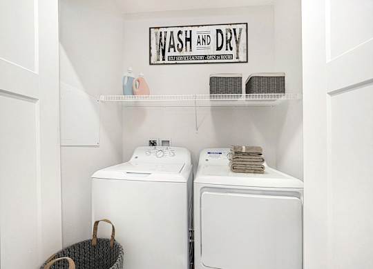 A full size washer and dryer at The Reserve at Destination Pointe apartments, Grimes, IA