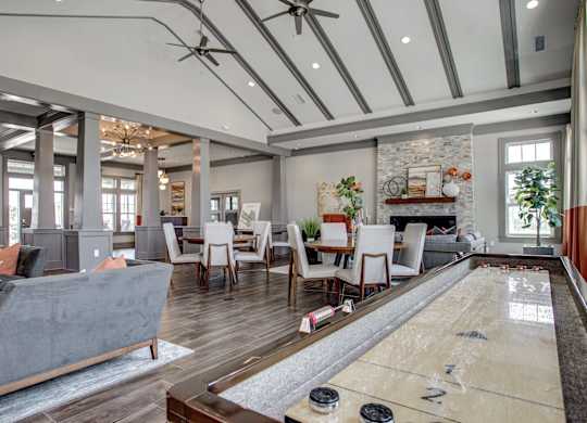 A room with a shiny wooden floor and a pool table. at River Crossing Apartments, Missouri, 63303