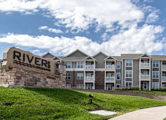 A building with a sign that says  at River Crossing Apartments, St. Charles, Missouri
